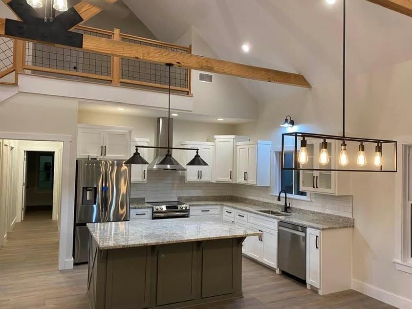 Finished kitchen with pendant lighting over the island
