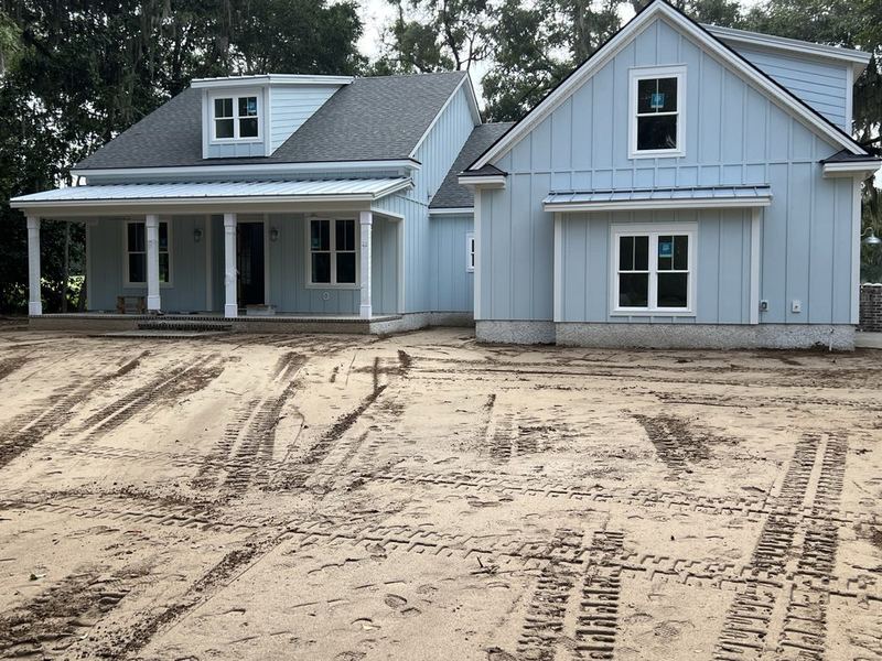 A house under construction with the electrical rough-in underway